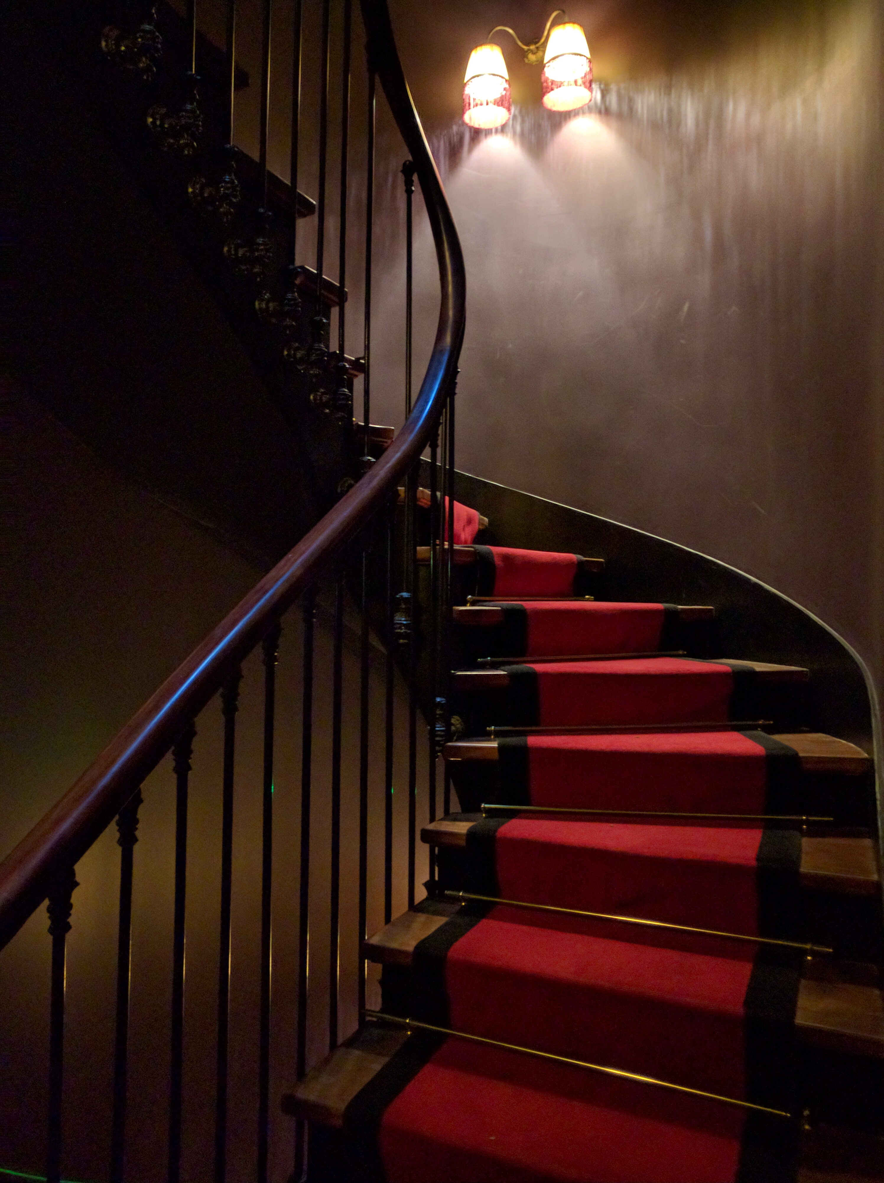 Spiral staircase up to the rooms from the bar 