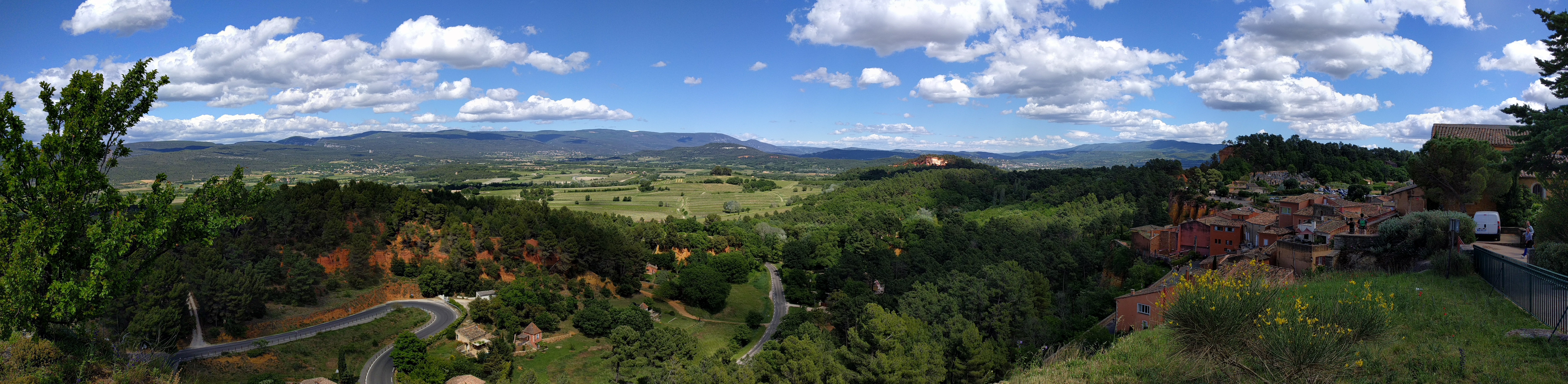 A panorama looking out when driving over to Roussillon, not far from Gordes. The town is famous for its history of ochre mining (note the earth's coloring)