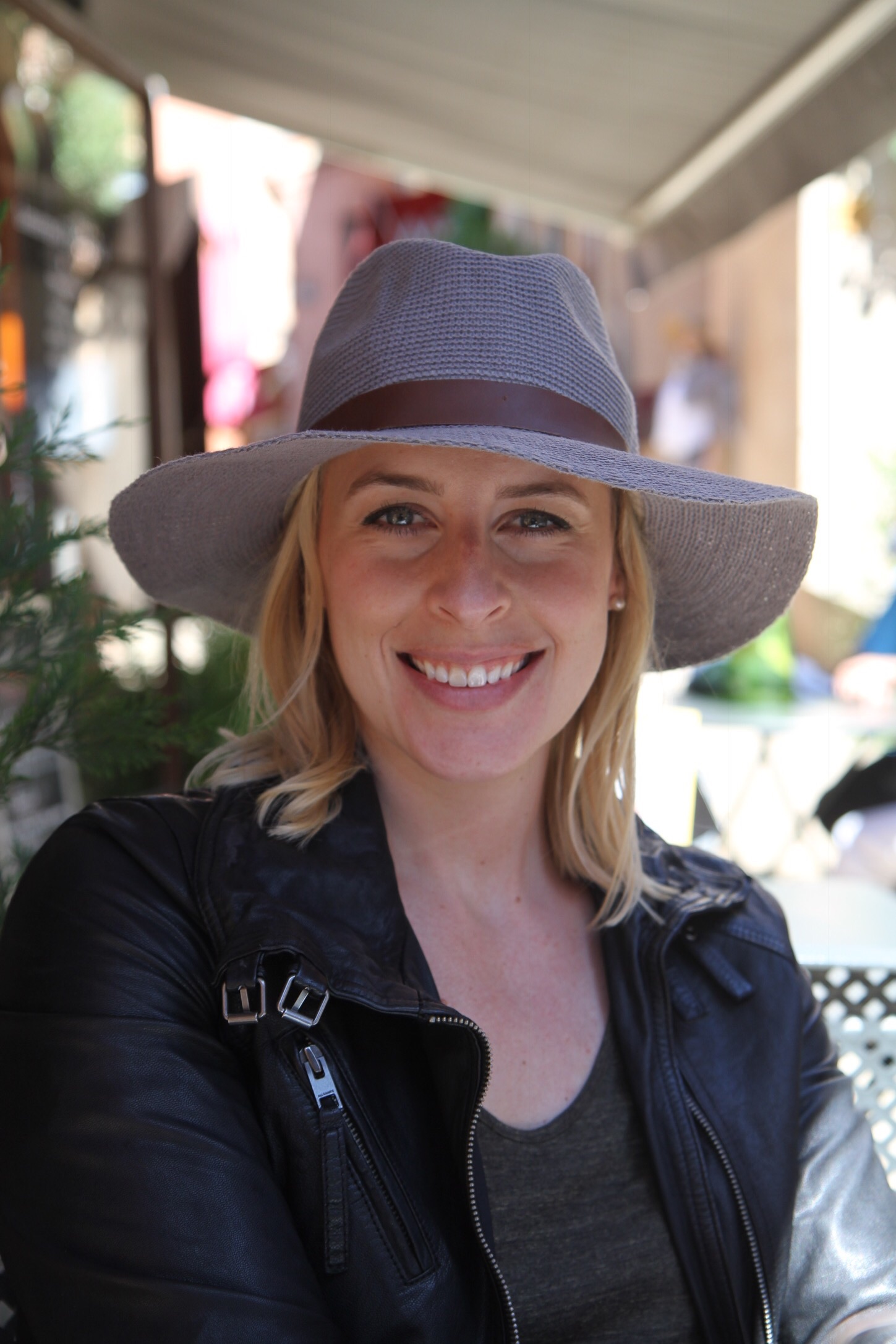 Kelly sitting around drinking at a cafe in Roussillon after roaming around town